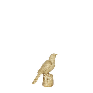 Gold bird ornament. Gold home accessories